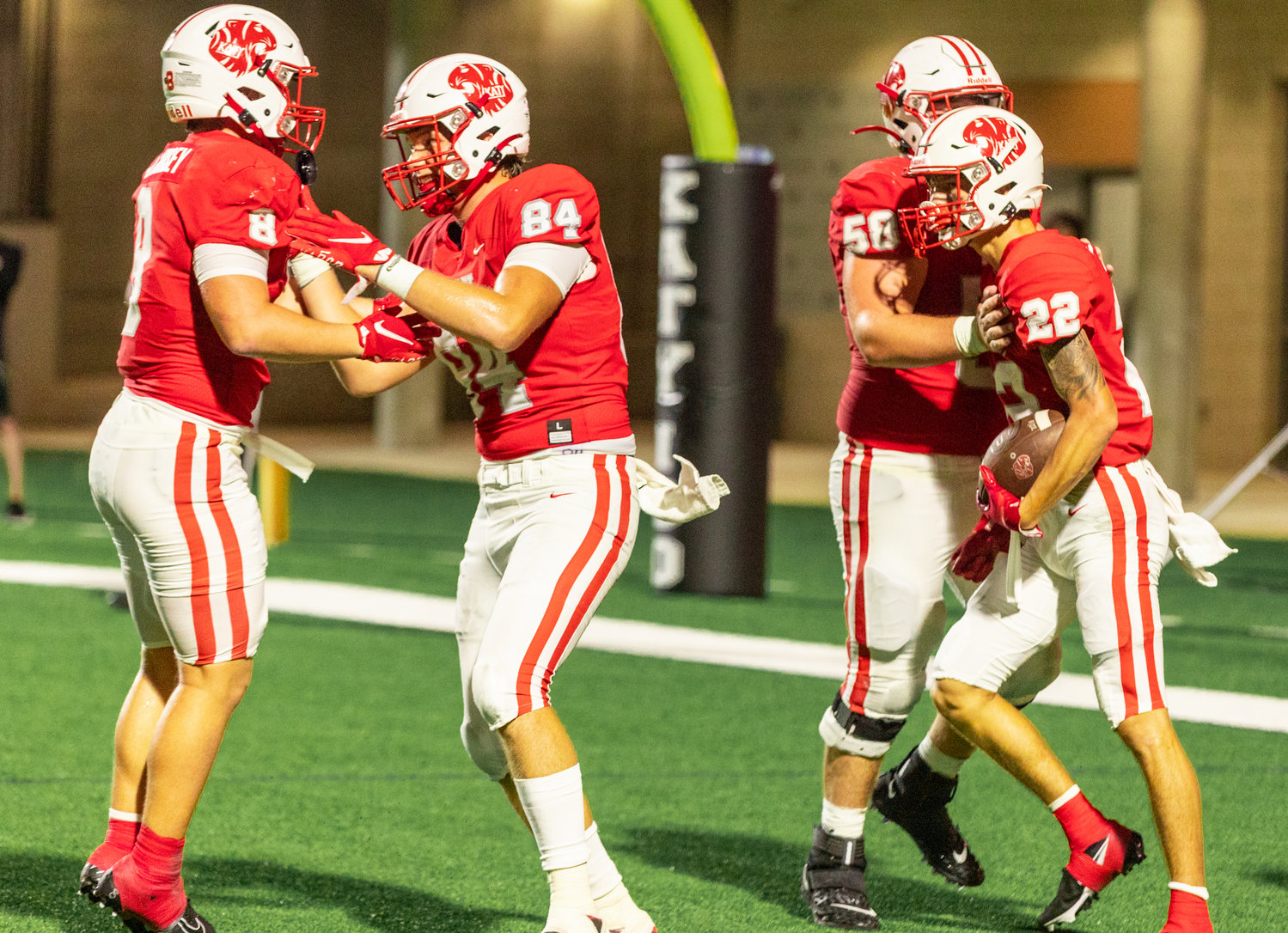 Katy’s Adam Jackson celebrates with his teammates after catching a touchdown pass during Friday’s game between Katy and Atascocita at Legacy Stadium.